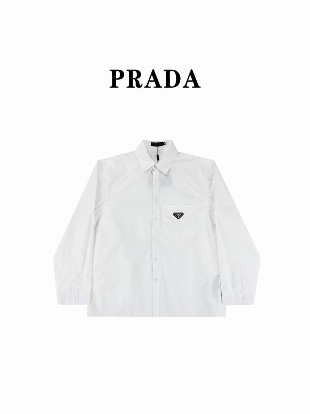 Prada 普拉达prd 24Ss三角标口袋府绸长袖衬衫 原9,900购入，采用70支人丝府绸布，表面做丝光工艺，手感比较光滑。该款采用德国最新埋夹机制做而成，